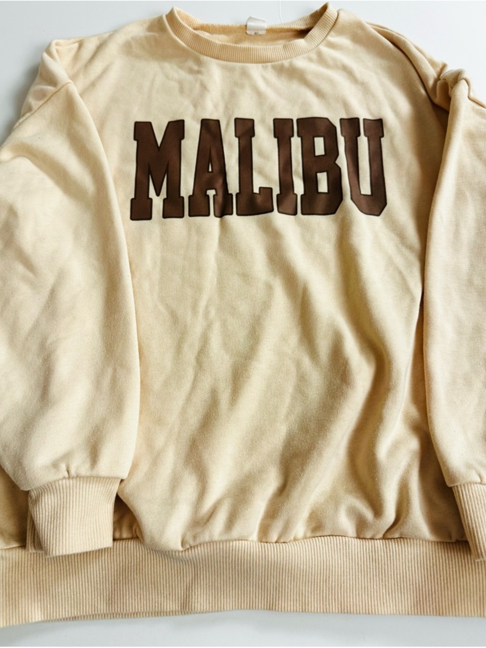 Girls Cream Sweatshirt with Malibu Brown Lettering. Size 11Y-12Y